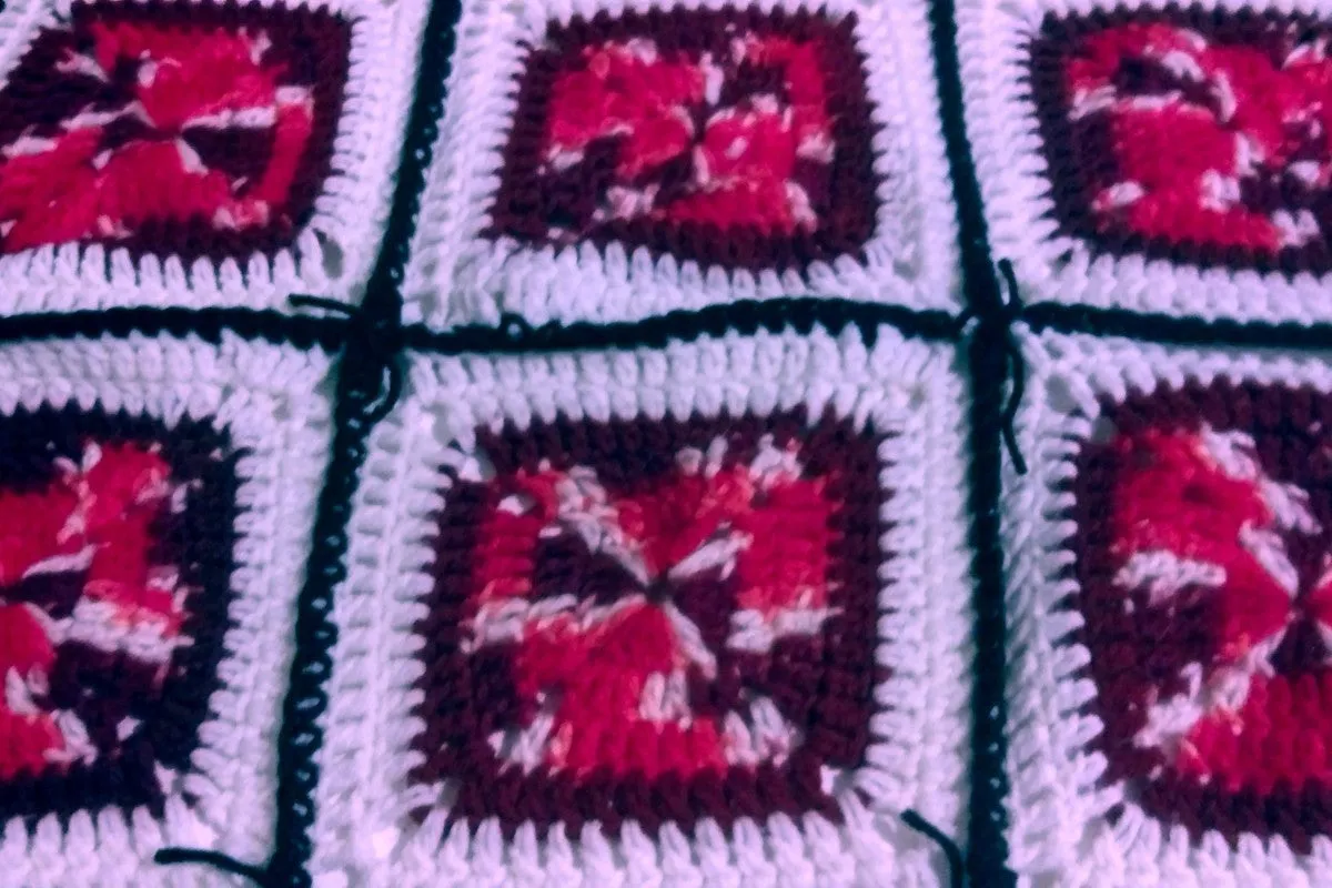 Handmade Granny Square hand crochet of Red, Whites, and Black Patchwork 5 squares by 5 squares Baby Blanket